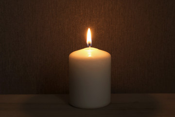 Fototapeta na wymiar Single burinig candle