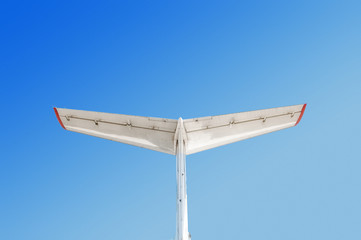 Fototapeta premium Tail of a jet airplane on sky background