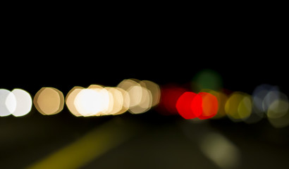 Traffic lights of the night city road. beautiful background of b