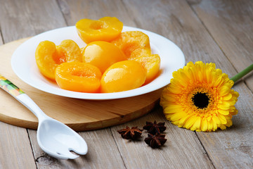 Peaches on the dish, spoon, anise and gerber
