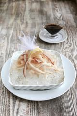 Sliced raw frozen fish with  ice