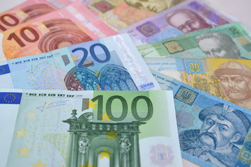Euro and Ukrainian paper money, background