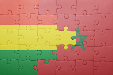 Obraz premium puzzle with the national flag of morocco and bolivia .