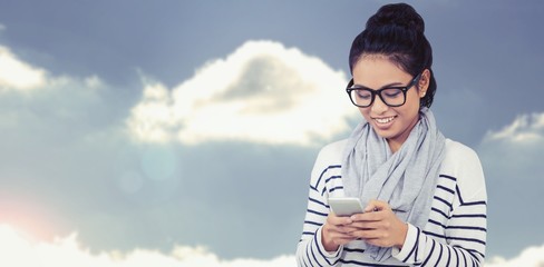Composite image of smiling asian woman using smartphone