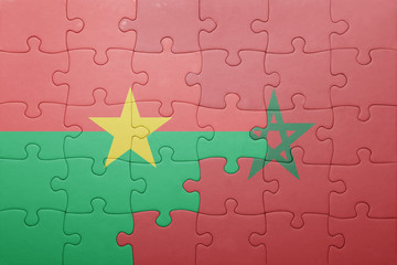 puzzle with the national flag of morocco and burkina faso .