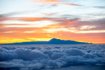 Beautiful cloudscape with Tenerife island on background on the sunrise in Spain