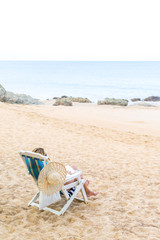 Fototapeta na wymiar Young woman relaxing on a beautiful beach.