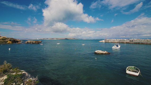 A pier with small boats of Island Tabarca, Spain