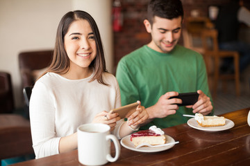 Couple taking photos of their food