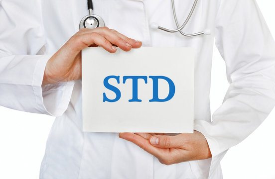 Doctor Holding A Card With STD, Medical Concept