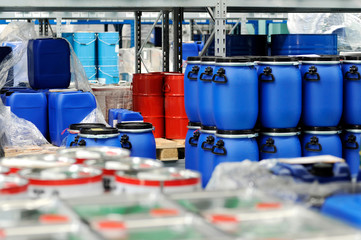 Plastic barrels or drums stored in a warehouse