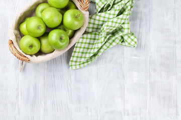 Green apples in basket