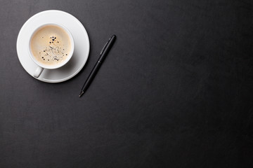 Obraz na płótnie Canvas Office desk with coffee cup and pen