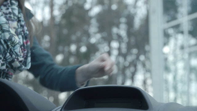 Woman detcets broken car glass