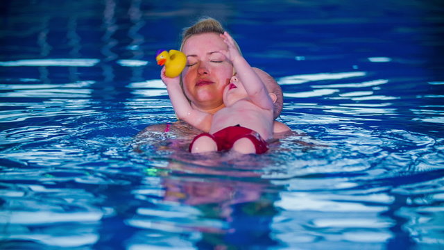 Newborn swims backstroke