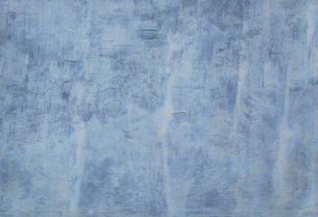 Poor whitewashed dirty blue concrete wall for background and texture.