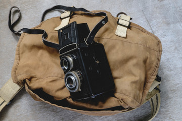 old vintage camera with a backpack