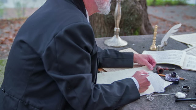 Writing a poem down with feather pan