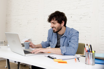Fototapeta premium corporate portrait young hispanic attractive hipster businessman working with computer modern home office
