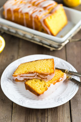 Lemon yogurt loaf cake, sliced on plate