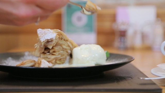 Cake and ice cream is spread on a plate.