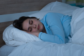 Woman Sleeping On Bed