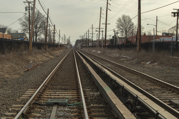Fototapeta na wymiar Train tracks into town