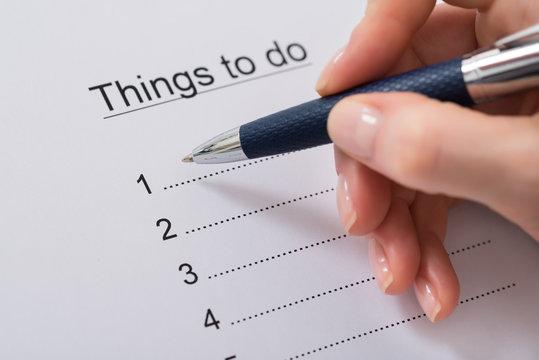 Woman Hand Writing Things To Do List