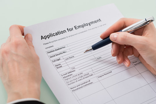 Woman Hand Filling Employment Form