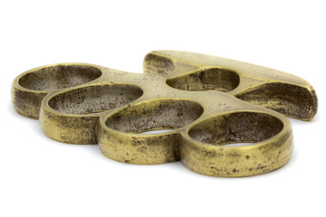 Brass knuckle-duster, weapon for hand, isolated on white backgro