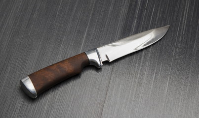 Beautiful hunting knife against a dark background