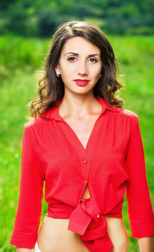 Portrait Of A Beautiful Young Woman In A Red Shirt  Outdoor