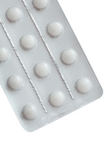 Pills in packing close-up isolated on white background