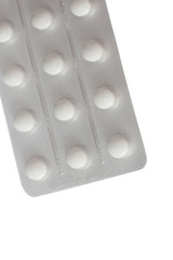 Pills in packing close-up isolated on white background