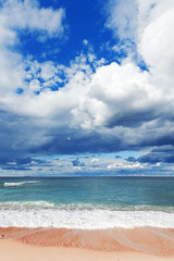 Fototapeta na wymiar exotic tropical beach, golden sand and beautiful clouds