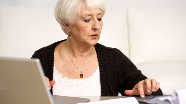 Senior woman working on personal finances