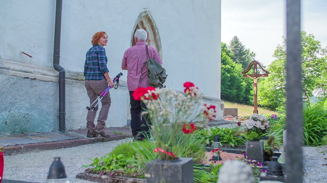 An older couple approaching the church entrance