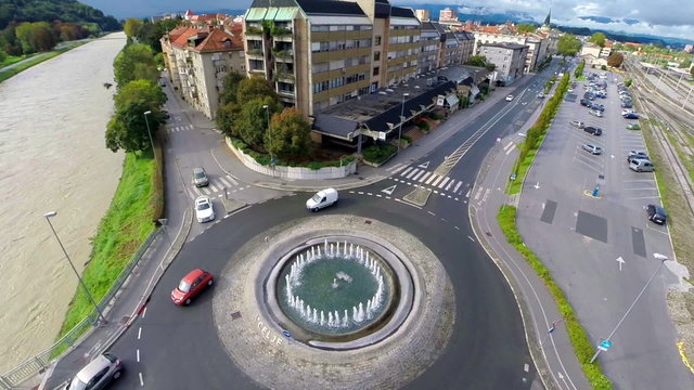 Aerial shot of roundabout with city in background