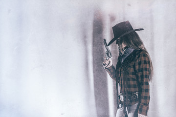 Cowgirl Gunslinger Gun Copy Space. Old west cowgirl gunslinger standing with peacemaker gun to the...