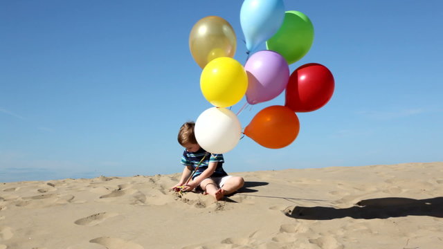 Young boy with balloons