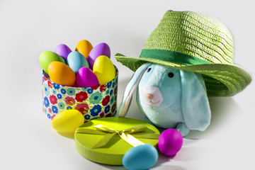  Blue Easter bunny rabbit with colorful Easter eggs and Green straw hat 