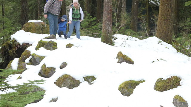 Family enjoying snowy hike