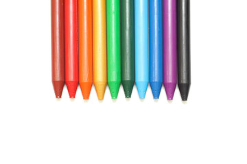 rainbow  wax crayons  isolated on white