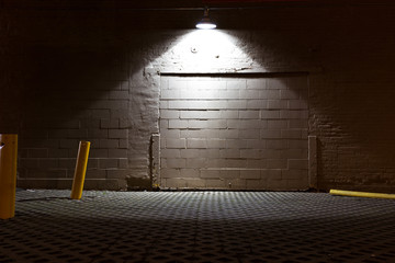 brick floor and  wall with a light in seattle at night