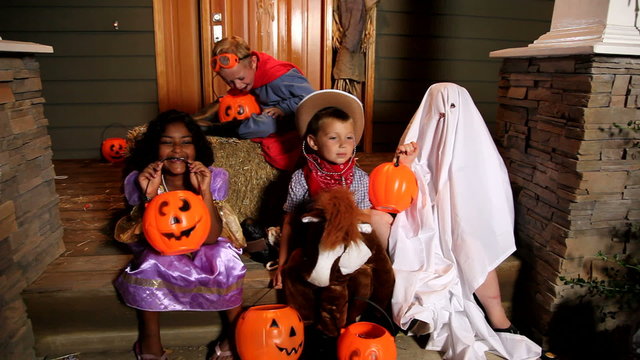 Children playing in Halloween costumes