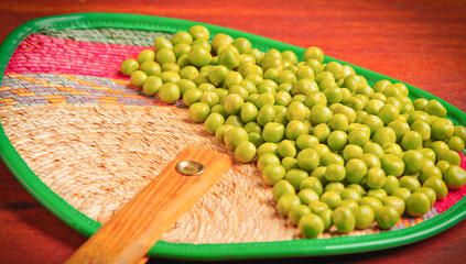 Nice display of many green lima beans. delicate layout over wooden surface