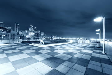 marble floor with cityscape of seattle at night