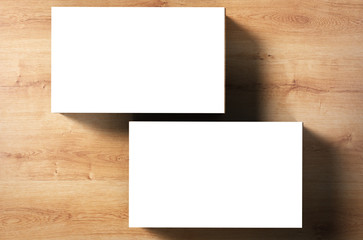 white blank name card front and back on wooden background