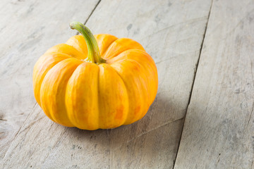 Jack o' lantern, halloween, pumpkins on wooden background