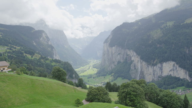 Landscape of Swiss Alps Lauterbrunnen valley in Switzerland, Europe in summer. Beautiful classic nature scenery from Bernese Oberland with mountains Jungfrau, Eiger and Monch in background. 